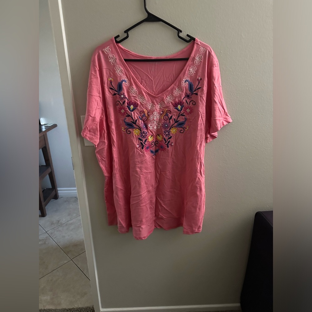 Pretty blouse with flower detail on front